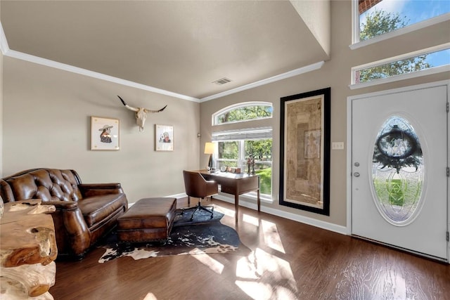 foyer entrance featuring ornamental molding and dark hardwood / wood-style floors