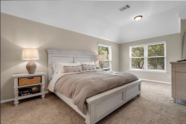 bedroom with light carpet, ornamental molding, and lofted ceiling