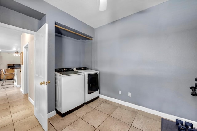 washroom featuring separate washer and dryer, light tile patterned floors, and ceiling fan