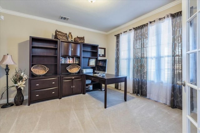 carpeted office space with crown molding and french doors