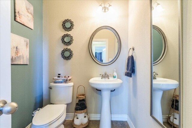 bathroom with sink and toilet