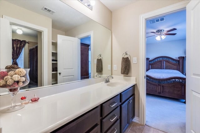 bathroom featuring vanity, tile patterned flooring, and ceiling fan