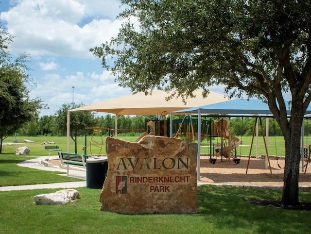 view of property's community featuring a playground and a yard