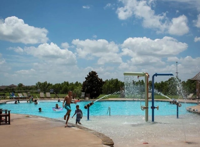 view of swimming pool featuring pool water feature