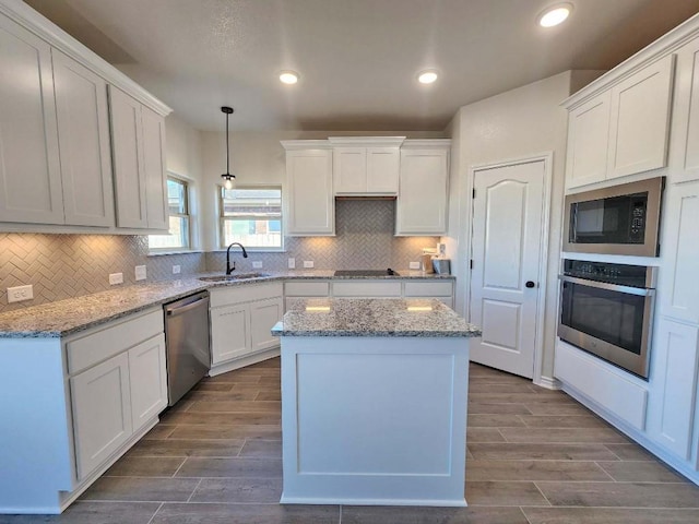 kitchen with white cabinets, sink, and black appliances