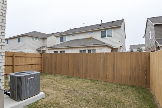 view of yard featuring central air condition unit