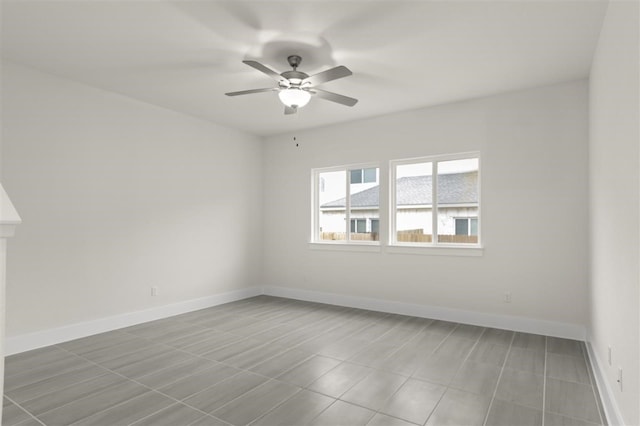 unfurnished room with ceiling fan