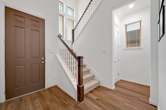 1632 Stone House, New Braunfels, TX 78132 - foyer entrance featuring wood finished floors, stairway, and recessed lighting