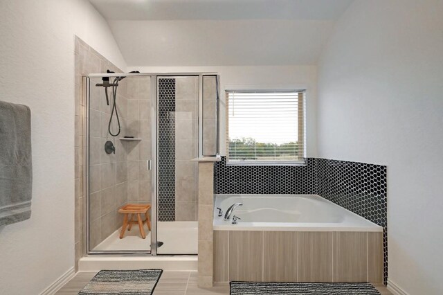 1632 Stone House, New Braunfels, TX 78132 - full bath with a bath, a shower stall, and vaulted ceiling
