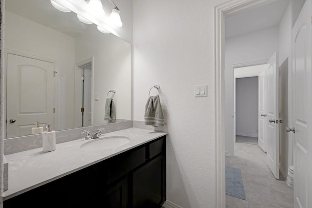 bathroom with vanity and tile patterned flooring