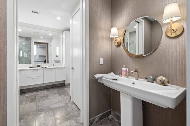 501 W Ave Unit 1403, Austin, TX 78701 - bathroom with a sink and marble finish flooring