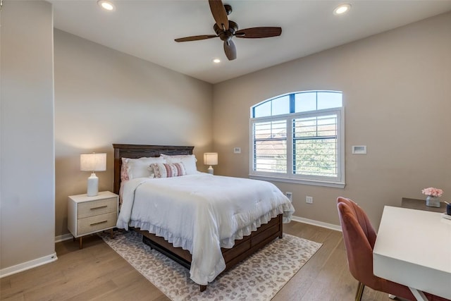 bedroom featuring ceiling fan and hardwood / wood-style floors