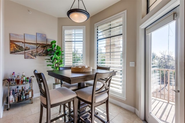 dining area featuring a healthy amount of sunlight and light tile patterned floors