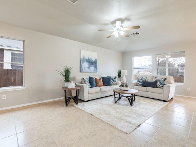 living room with light tile patterned flooring and ceiling fan