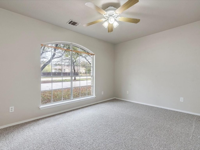 empty room with carpet floors and ceiling fan