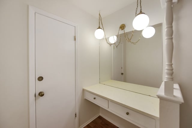 bathroom with hardwood / wood-style floors