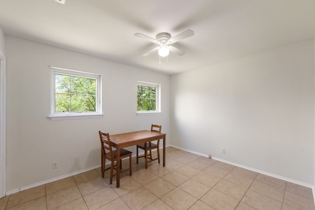 tiled dining room featuring ceiling fan