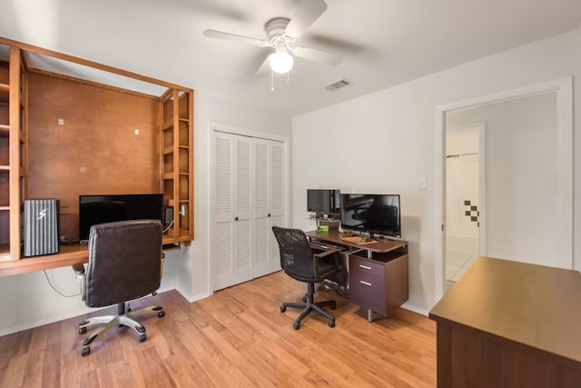 office space featuring ceiling fan and light hardwood / wood-style flooring