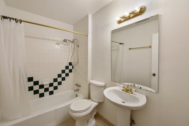 full bathroom featuring sink, toilet, and shower / bath combo with shower curtain