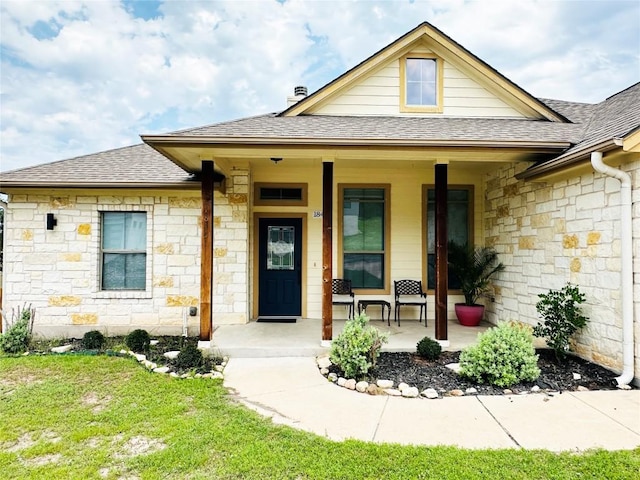 exterior space featuring a yard and covered porch