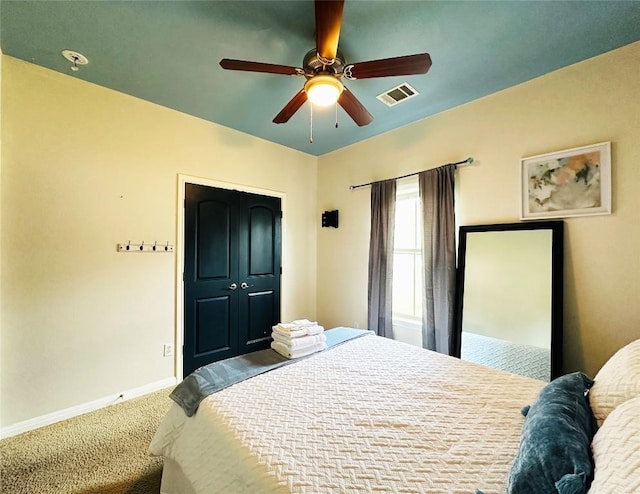 carpeted bedroom with ceiling fan