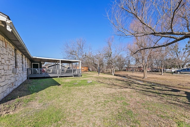 view of yard with a deck