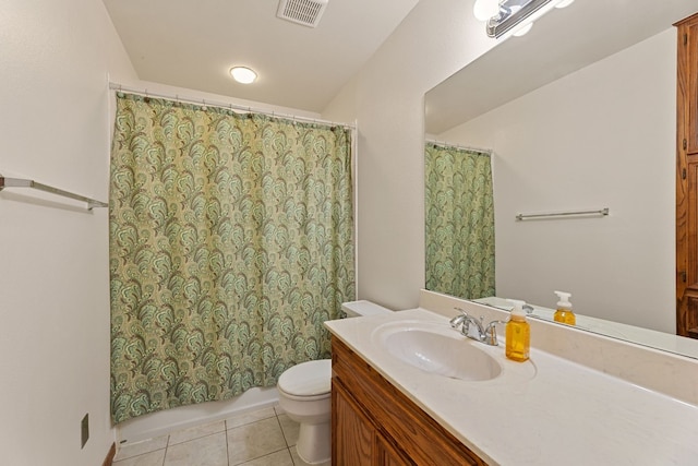 bathroom with tile patterned floors, toilet, and vanity