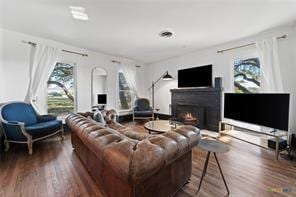 living room featuring dark wood-type flooring