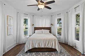 bedroom with ceiling fan, access to exterior, and dark hardwood / wood-style flooring