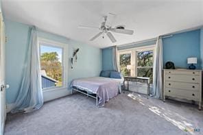 carpeted bedroom featuring ceiling fan