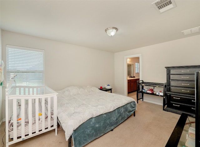 bedroom with light carpet