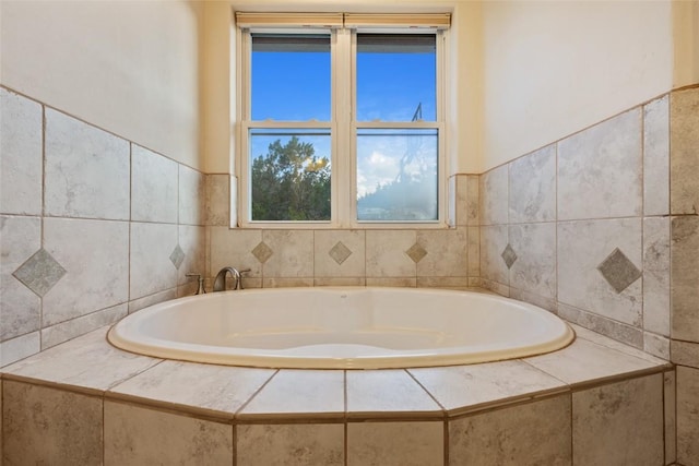 bathroom with tiled bath