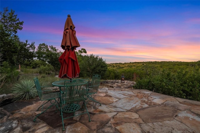 view of patio terrace at dusk