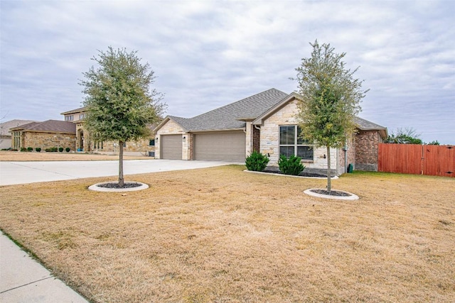 view of front facade featuring a garage and a front yard