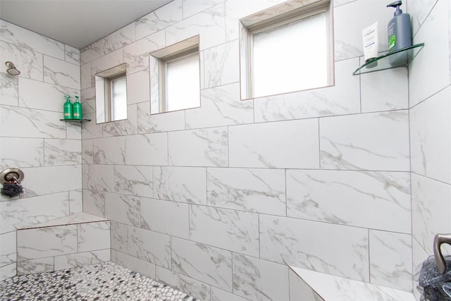 bathroom with tiled shower