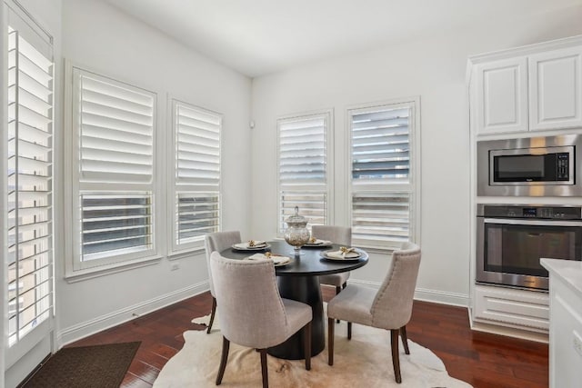 dining area featuring dark hardwood / wood-style floors and a wealth of natural light