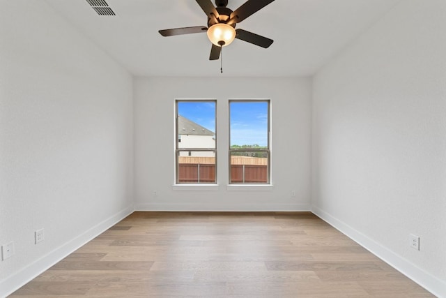 1243 Robin Trl, Round Rock, TX 78681 - empty room with ceiling fan, light wood-style floors, and baseboards