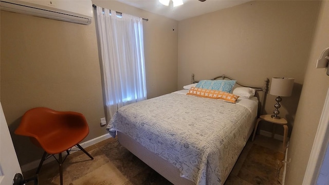 bedroom with a wall unit AC