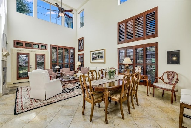 dining area featuring french doors and ceiling fan