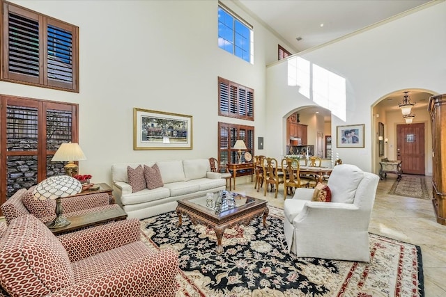 living room with a high ceiling