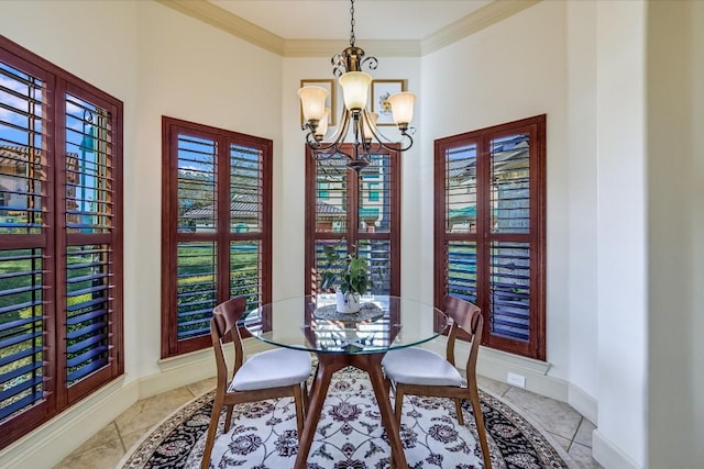 dining space with ornamental molding and an inviting chandelier