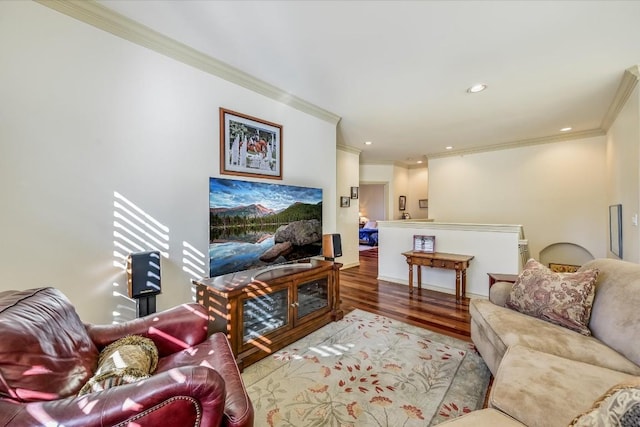 living room with hardwood / wood-style flooring and ornamental molding