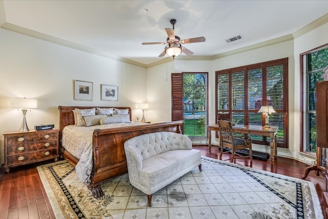 bedroom with ornamental molding, hardwood / wood-style floors, and ceiling fan