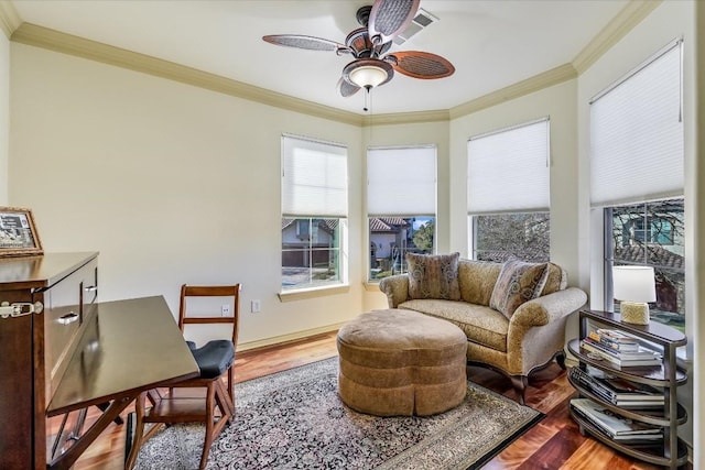 interior space with hardwood / wood-style flooring, ornamental molding, and ceiling fan