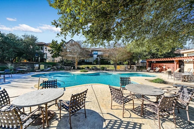 view of swimming pool featuring a patio area