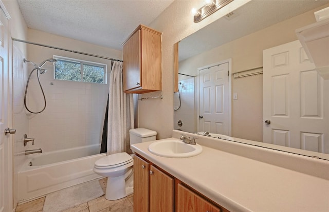 full bathroom featuring shower / bath combo, vanity, a textured ceiling, and toilet