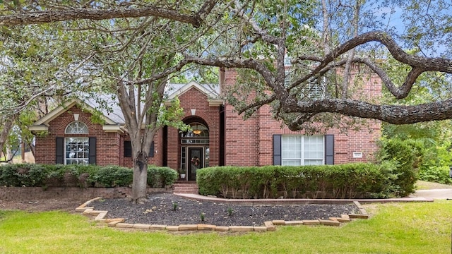 104 Fenway Ct, Lakeway, TX 78734 - view of front of house featuring brick siding and a front yard