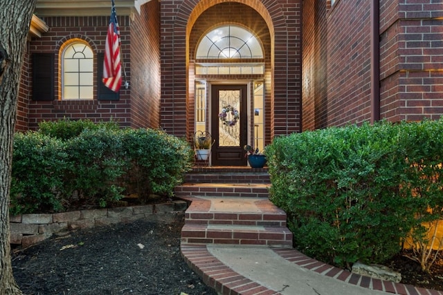 104 Fenway Ct, Lakeway, TX 78734 - view of exterior entry featuring brick siding