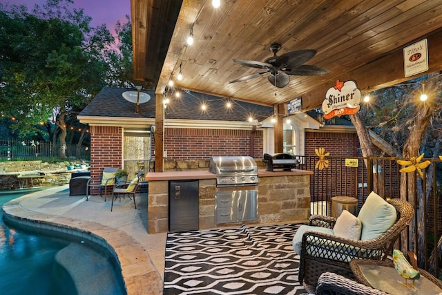 patio terrace at dusk featuring a grill, area for grilling, and ceiling fan