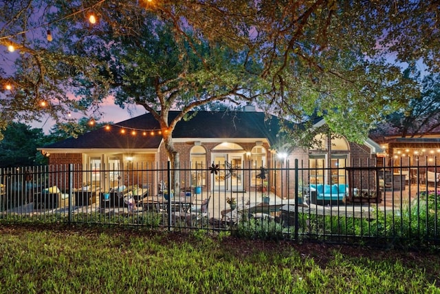 104 Fenway Ct, Lakeway, TX 78734 - rear view of property with brick siding and a patio area